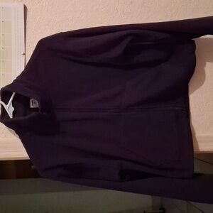 A black cropped zipper up jacket